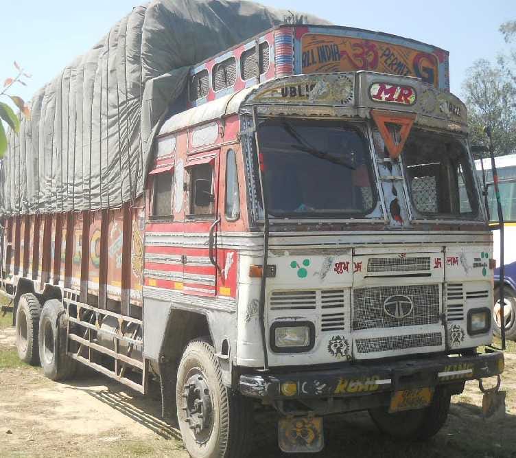 Truck crashes biker, mother and son