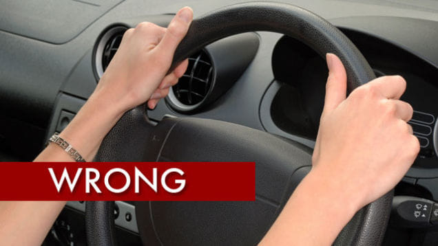 how to hold car steering wheel during driving