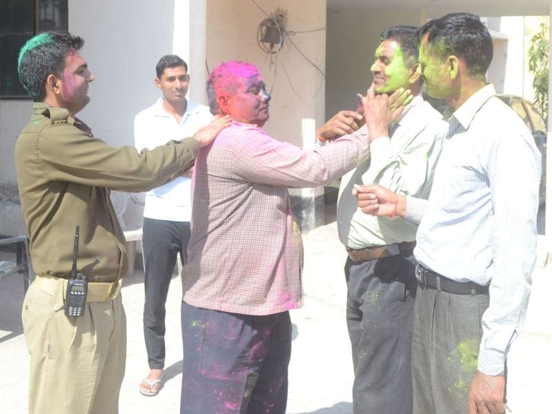 Policemen immersed in Holi's fun after duty
