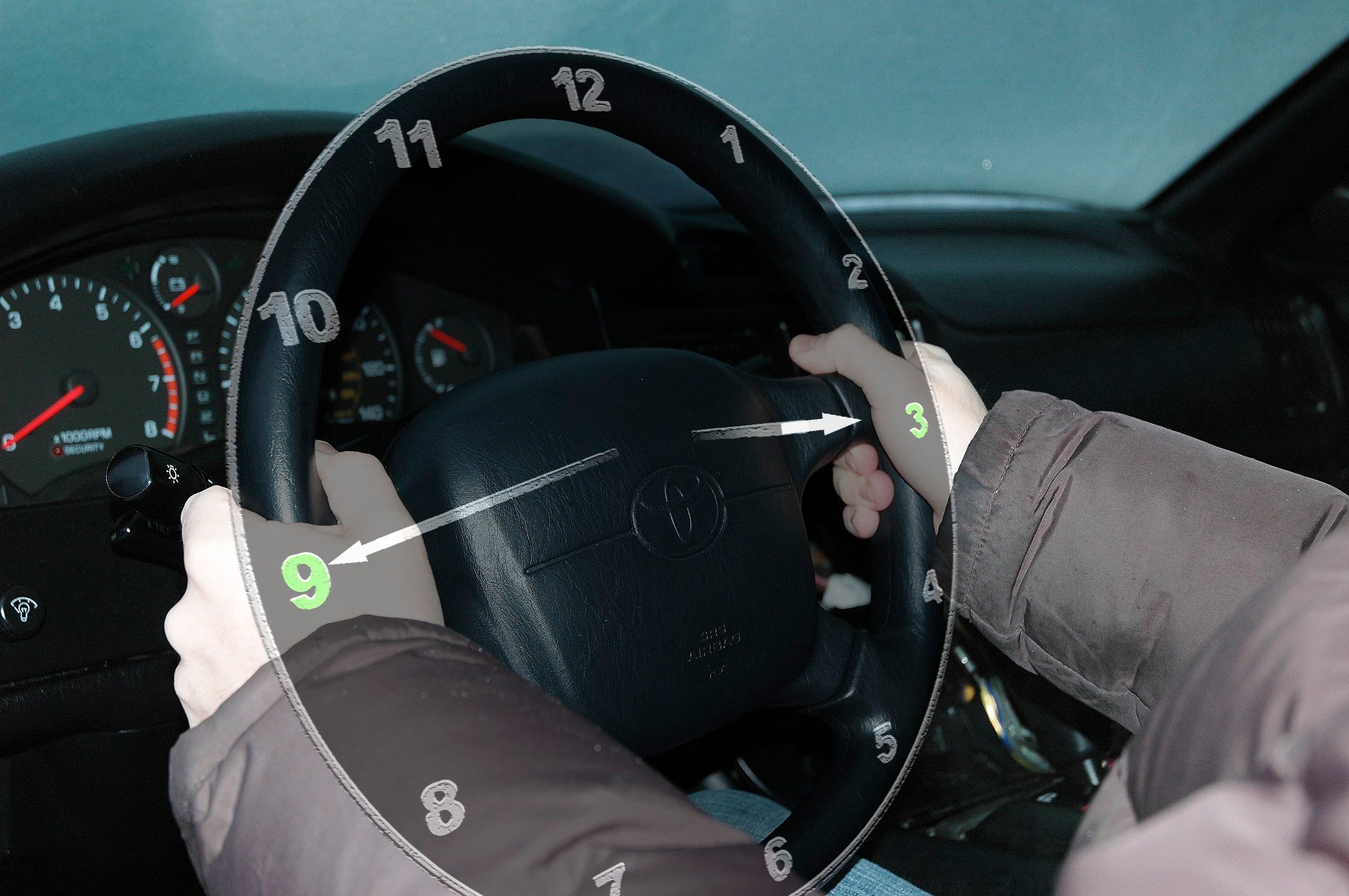 how to hold car steering wheel during driving