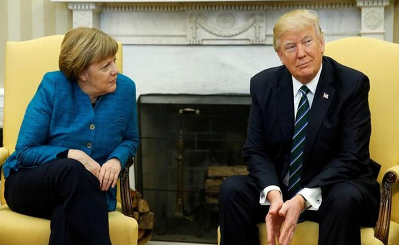 Awkward photo-op: Trump snubs Angela Merkel's request for handshake
