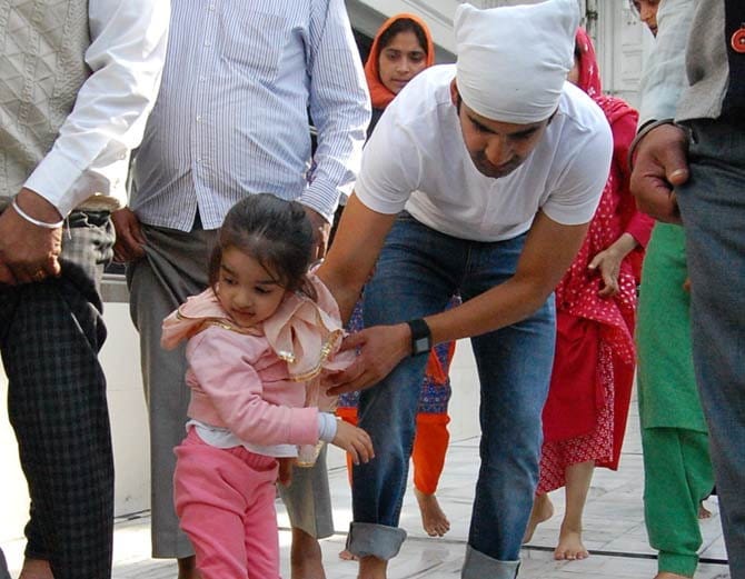 indian cricket team star opener gautam gambhir with wife and daughter at golden temple