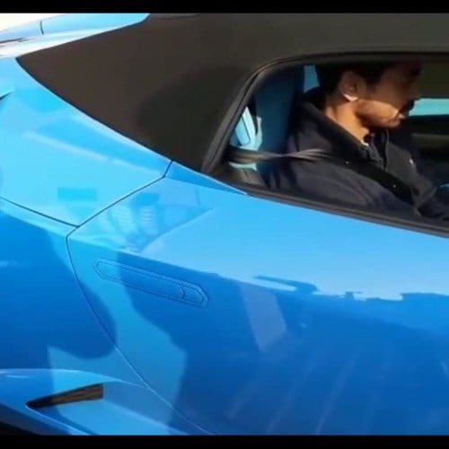 prateek yadav with his lamborgini car.
