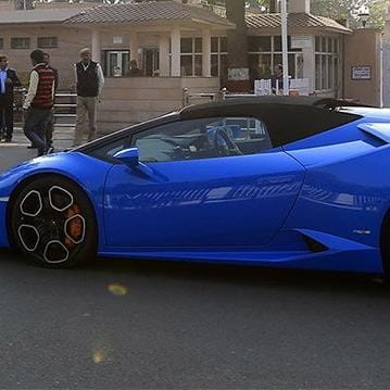 prateek yadav with his lamborgini car.
