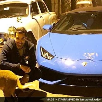 prateek yadav with his lamborgini car.