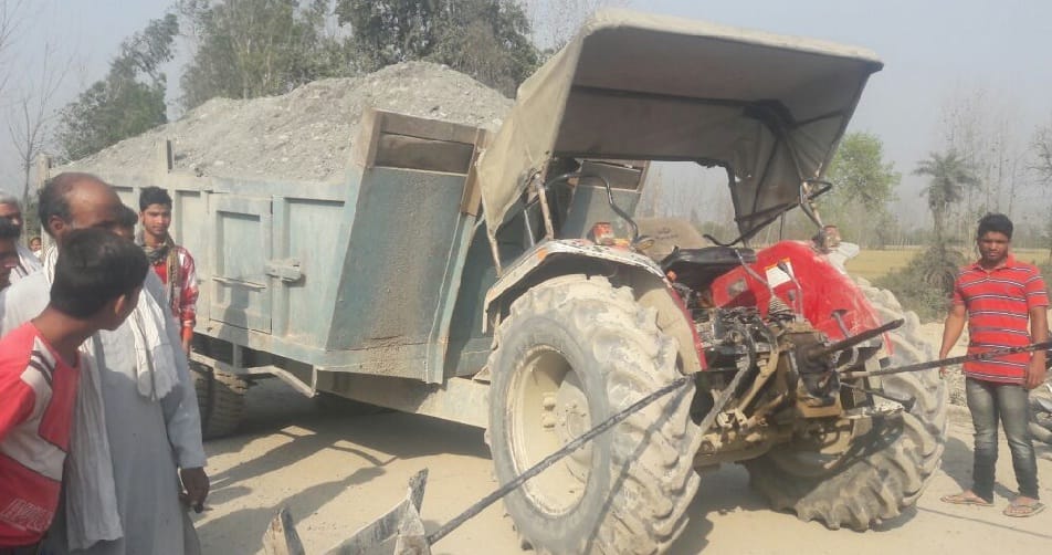 Broken tractor by train