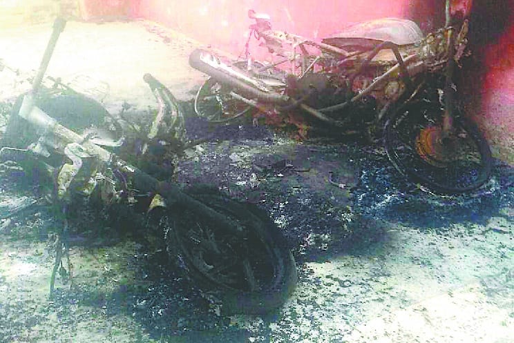 At the veranda of the school, the motorcycles parked in the park