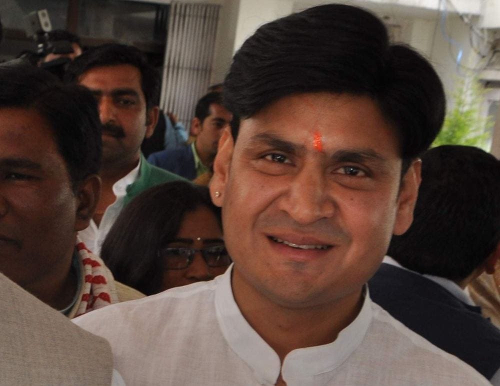 minister yashpal arya took oath with his son sanjeev
