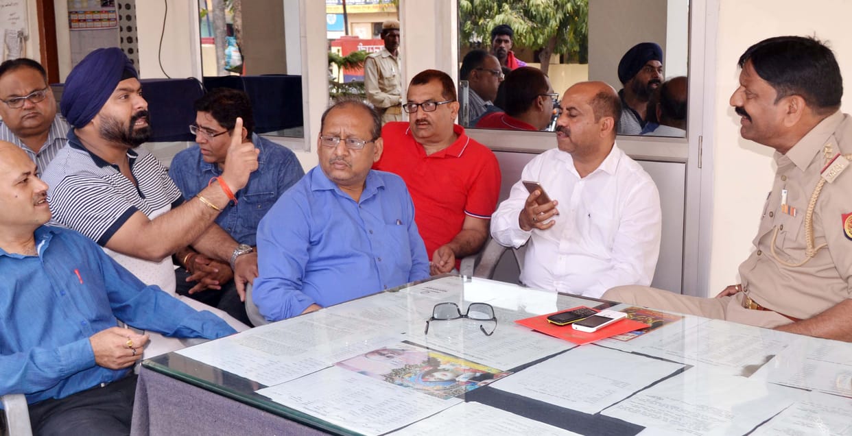Angry businessmen storm the station, fiercely