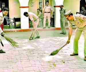 Policemen clean up the police station