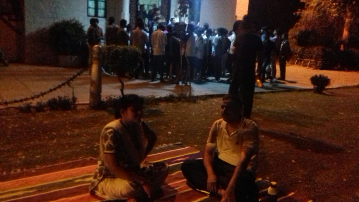 Suspended teacher sitting on fasting in university