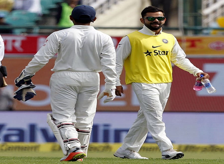 Dharamsala Test: injured Kohli bringing teammates drinks