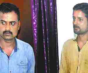 Two frauds arrested