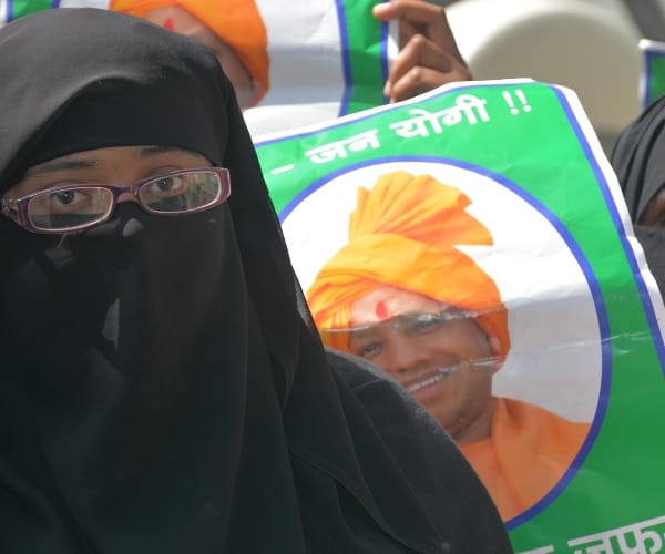  muslims protest with modi and yogi pictures.