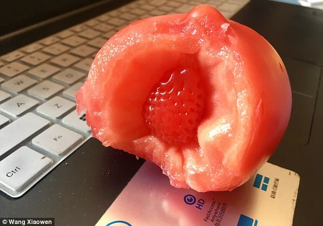 Man finds strawberry inside tomato