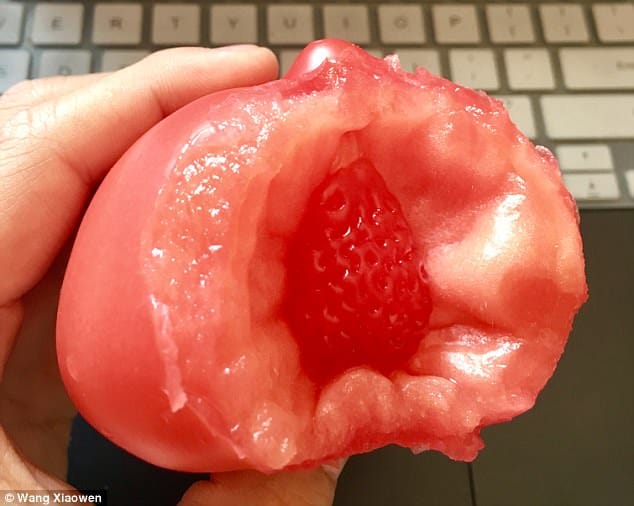 Man finds strawberry inside tomato