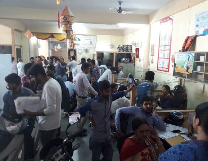 huge crowd of people for purchasing of two wheelers after supreme court decision on bs3 vehicles