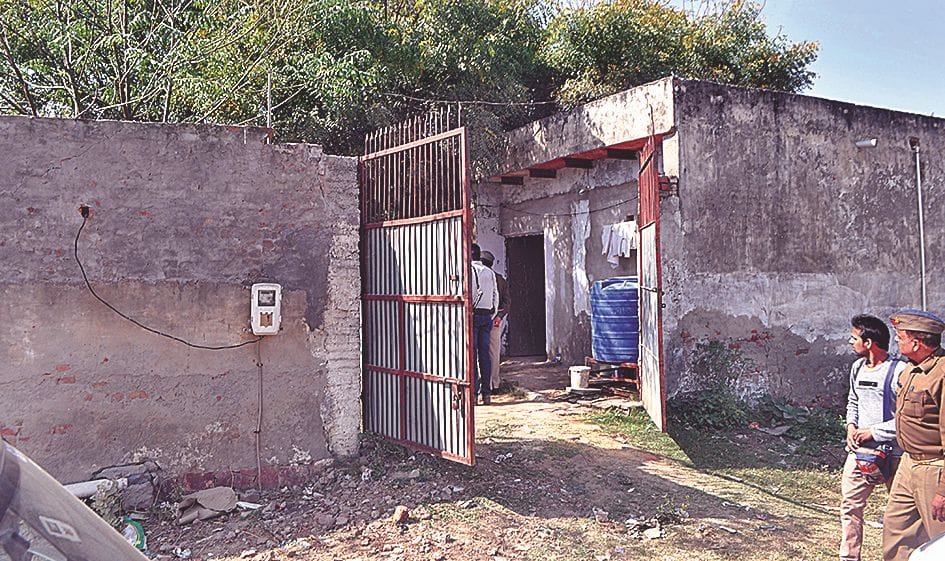 Police guarding the illegal weapon factory
