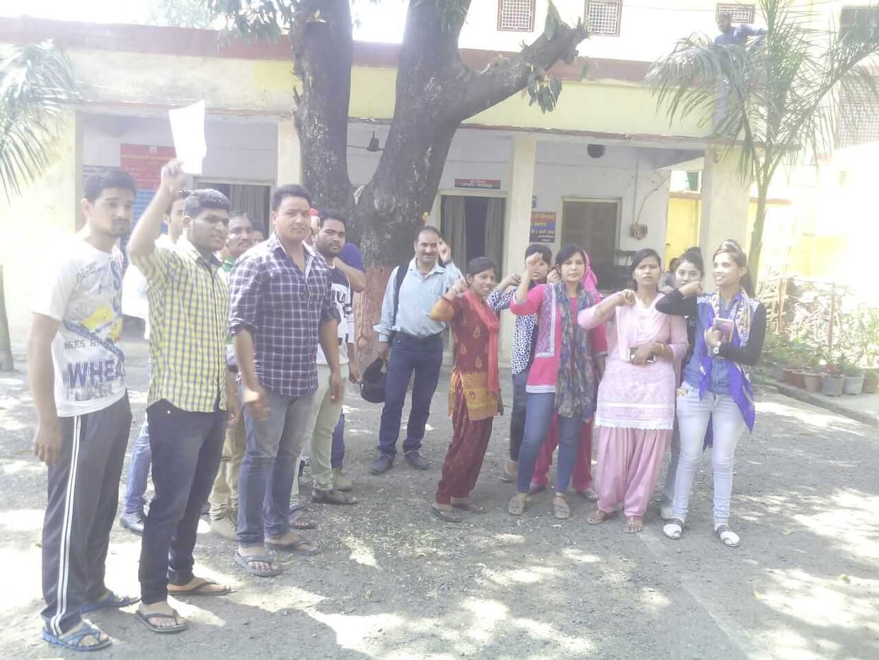 Factory worker strikes outside minister's house
