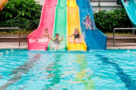 Open swimming pool, splashy kids floating