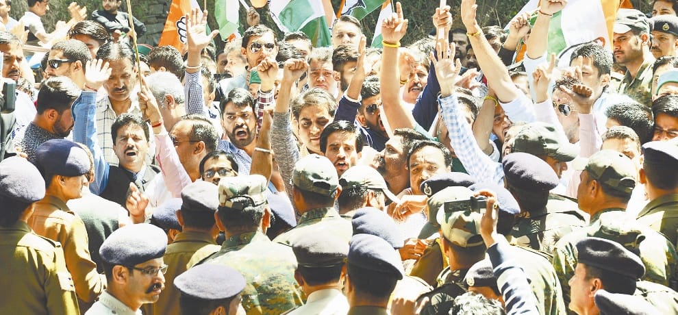 Congress workers protest outside residence of ex CM Prem Kumar Dhumal 