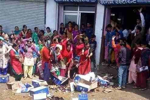 Anger broke against the liquor shop.