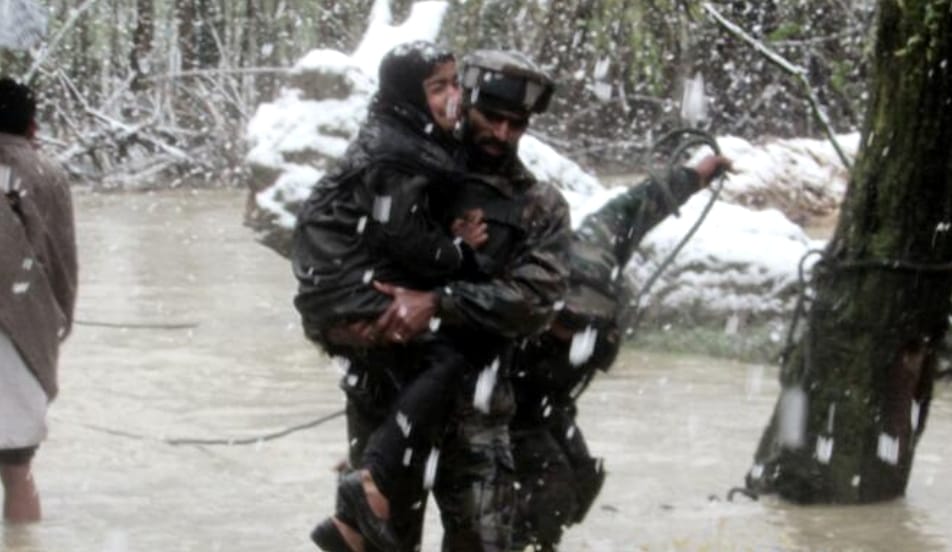 security PERSONNEL SAVING PEOPLE FROM FLOOD IN VALLEY