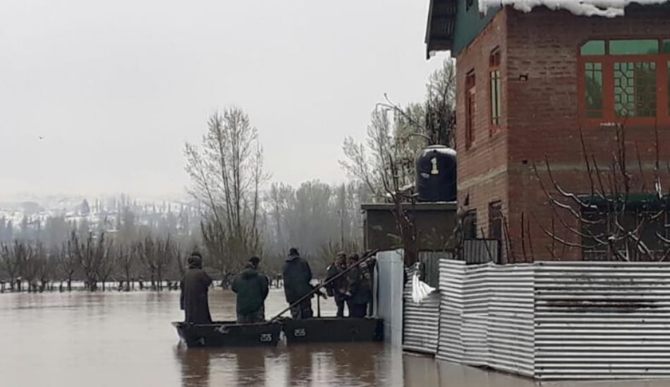 security PERSONNEL SAVING PEOPLE FROM FLOOD IN VALLEY
