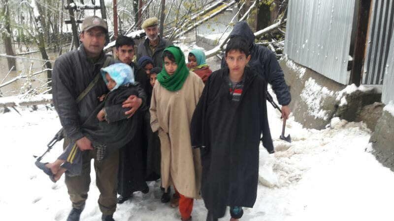 security PERSONNEL SAVING PEOPLE FROM FLOOD IN VALLEY