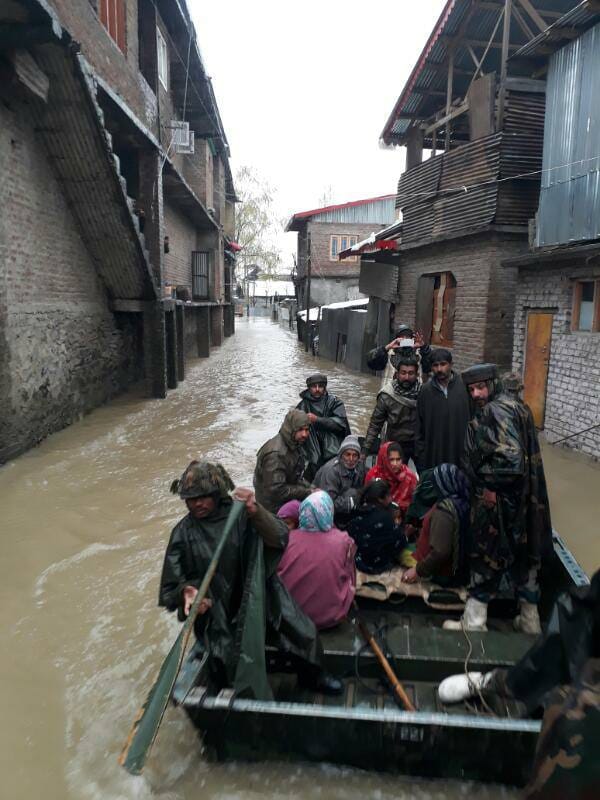 security PERSONNEL SAVING PEOPLE FROM FLOOD IN VALLEY