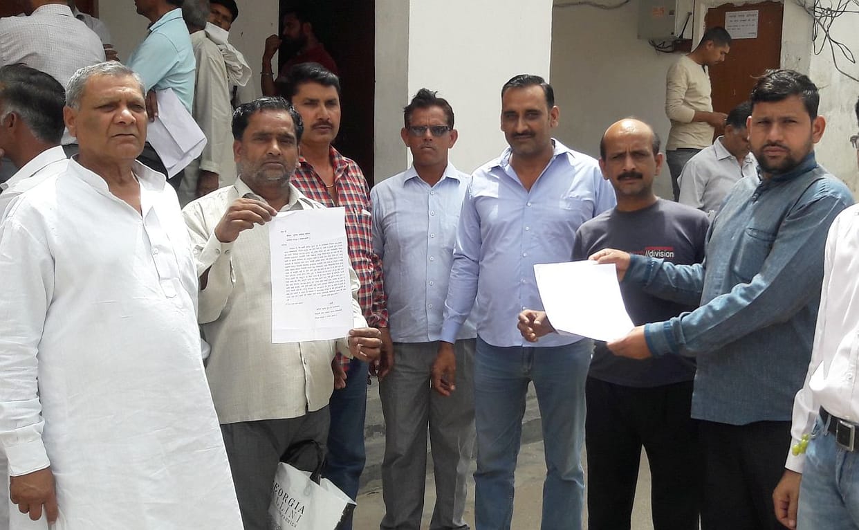 Reports on three including Center Administrator in recovering Rs.