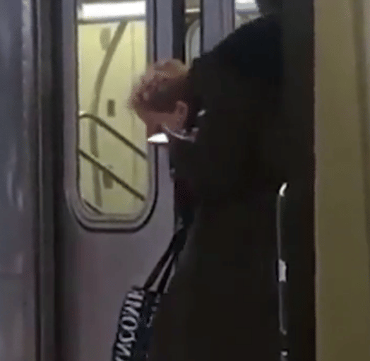 women head stuck in metro