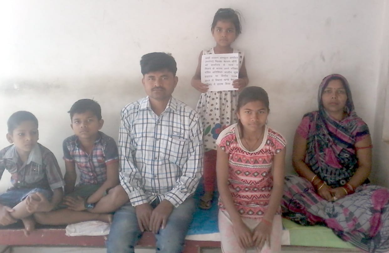 Family sitting on hunger strike in front of BDO office