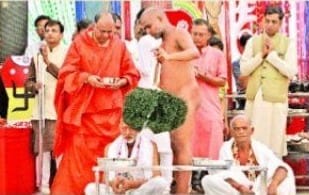 Father initiated Jain Dharam with son