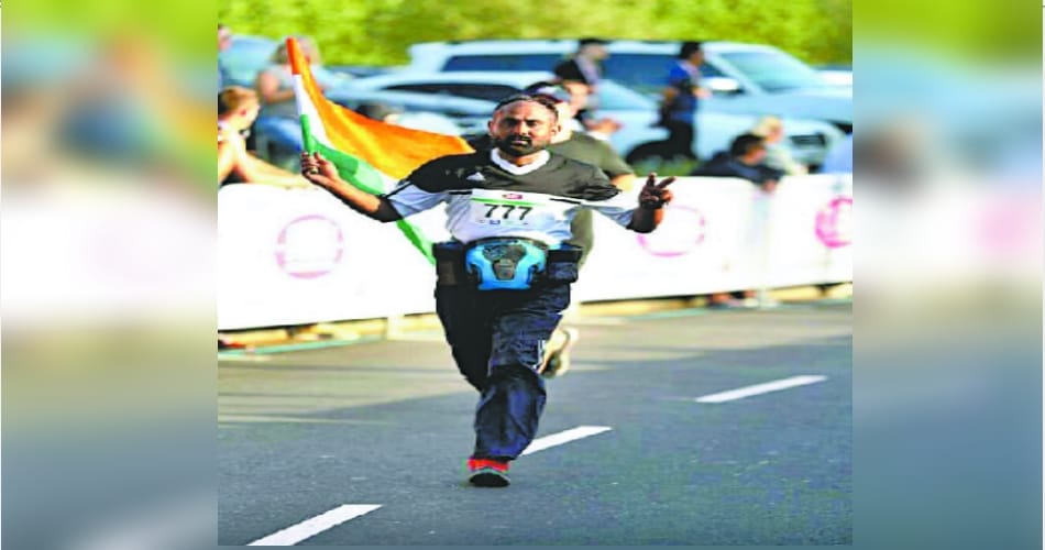 Sarabjit from Punjab, running with tricoloured in Dubai