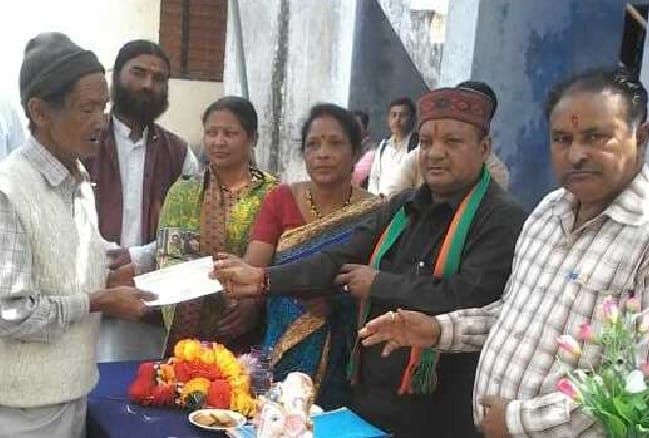 MLA picks up check