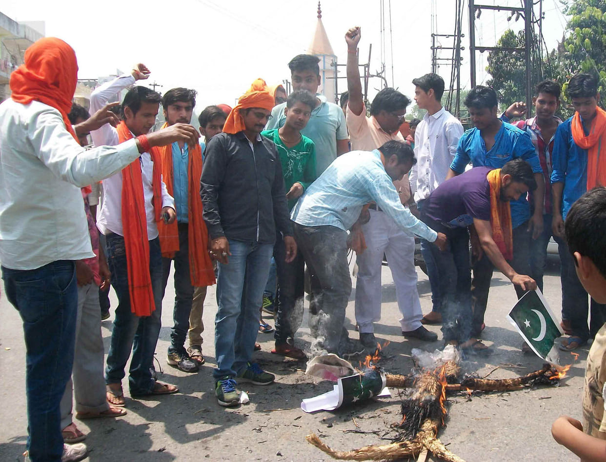 bajrand dal put fire in pakistani flag