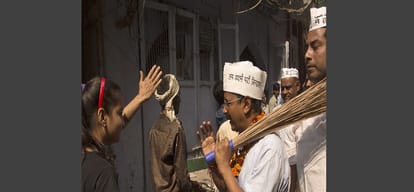 arvind kejriwal aam aadmi party release poster with broom for mcd polls