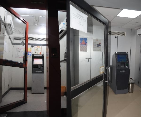 Try to rob the ATM again, run away from the siren