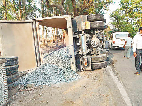 The ballast laden dumpers on the highway trample the old