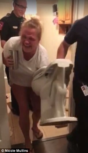 women stuck her hand in toilet