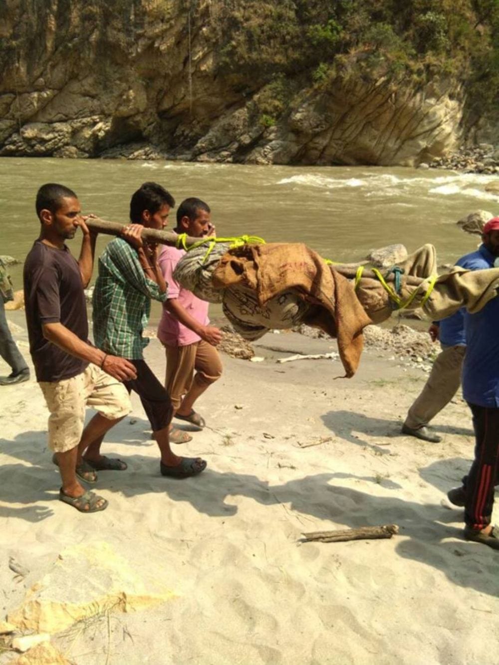 Dead bodies being removed in very bad condition