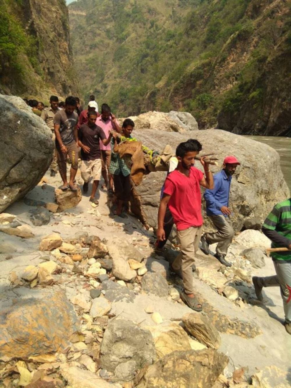 Dead bodies being removed in very bad condition