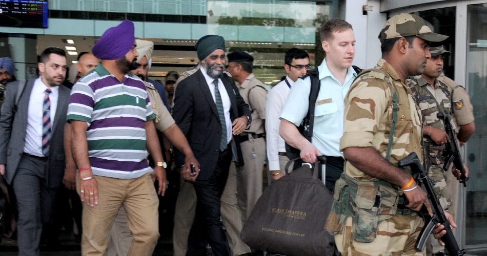 canada indian origin defence minister asked to quit down by opposition over his alleged remarks