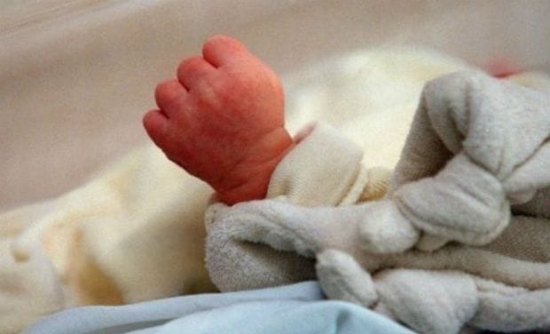 new born baby girl suppressed under cow dung pulled out alive