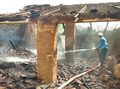 Sparks, burnt cattle and houses coming out of a litter pile