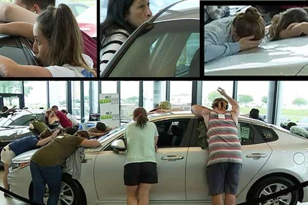 women won car after kissing it 50 hr continiously