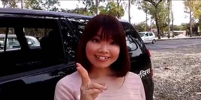 I-10 Japanese woman bumped by scorpio, cool in taking the police selfie