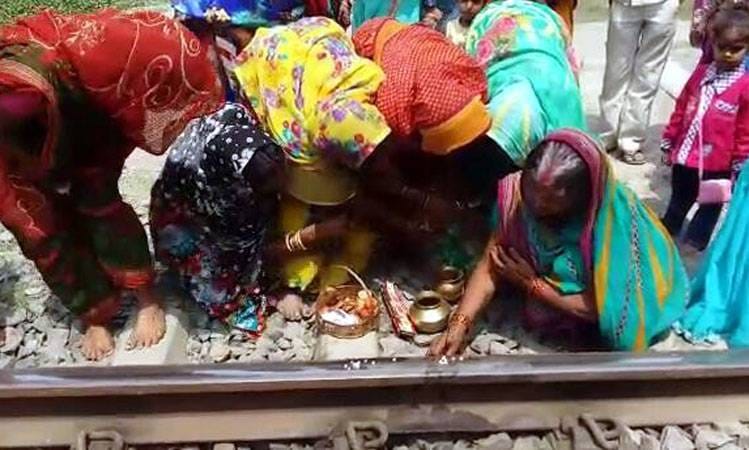 women in a village of Bihar worship railway track