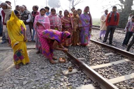 women in a village of Bihar worship railway track